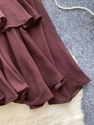 Brown chiffon tiered blouse with ruffled details