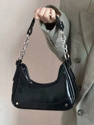 Black PU leather mini shoulder bag with silver chain strap and black strap detail.