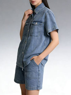 Button-up denim top and shorts set in sky blue, collared, short-sleeve shirt with chest pockets.