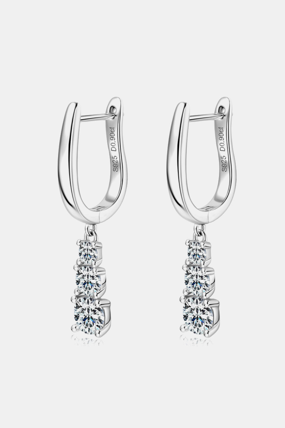 Silver cascading moissanite hoop earrings with three graduated stones.