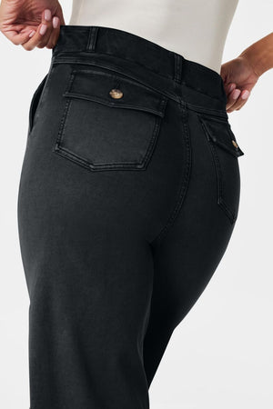 Wide-leg utility denim trousers in dark gray with buttoned back pockets.