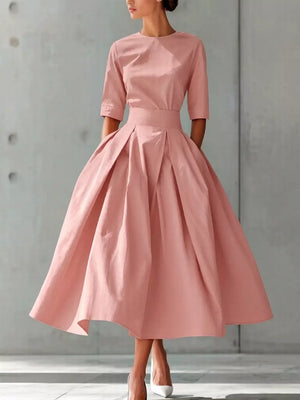 Dusty pink A-line midi dress with pleated skirt and short sleeves.