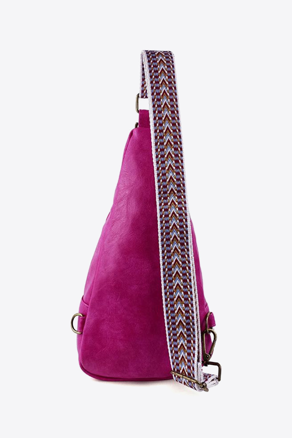 Textured magenta crossbody bag with a woven patterned adjustable strap