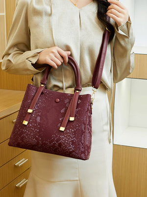 handbag in Wine Red with snakeskin and top handles