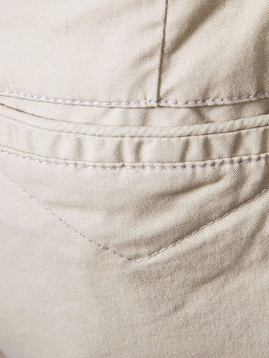 Khaki chino shorts detail with double-stitched pocket and relaxed fit.