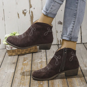 Chocolate suede western ankle boots with white embroidery and side zipper detail.