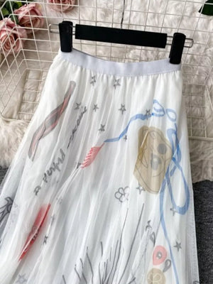 White tulle skirt with abstract whimsical print and stars.