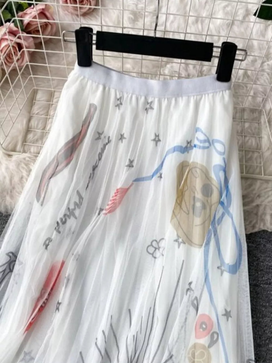 White tulle skirt with abstract whimsical print and stars.