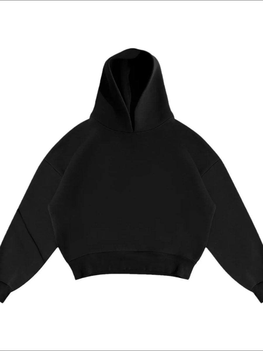 Black oversized hooded sweatshirt with drop shoulders and a relaxed fit.