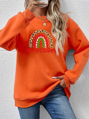 Orange Christmas sweatshirt with rainbow graphic and leopard print detail.