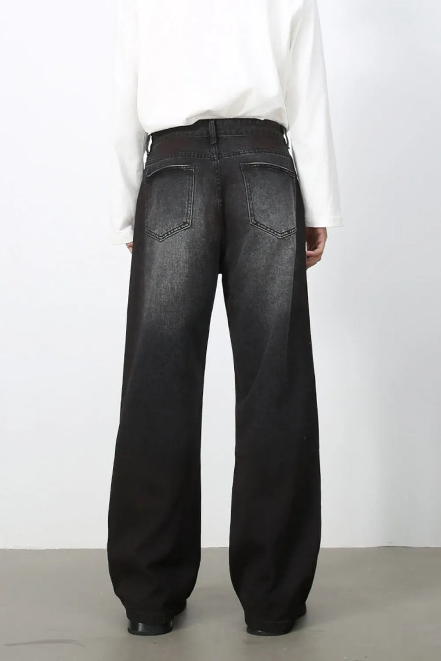 Faded dark wide-leg denim jeans with a relaxed fit.