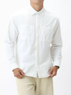 Men's white cotton button-down shirt with two chest pockets and a classic collar.