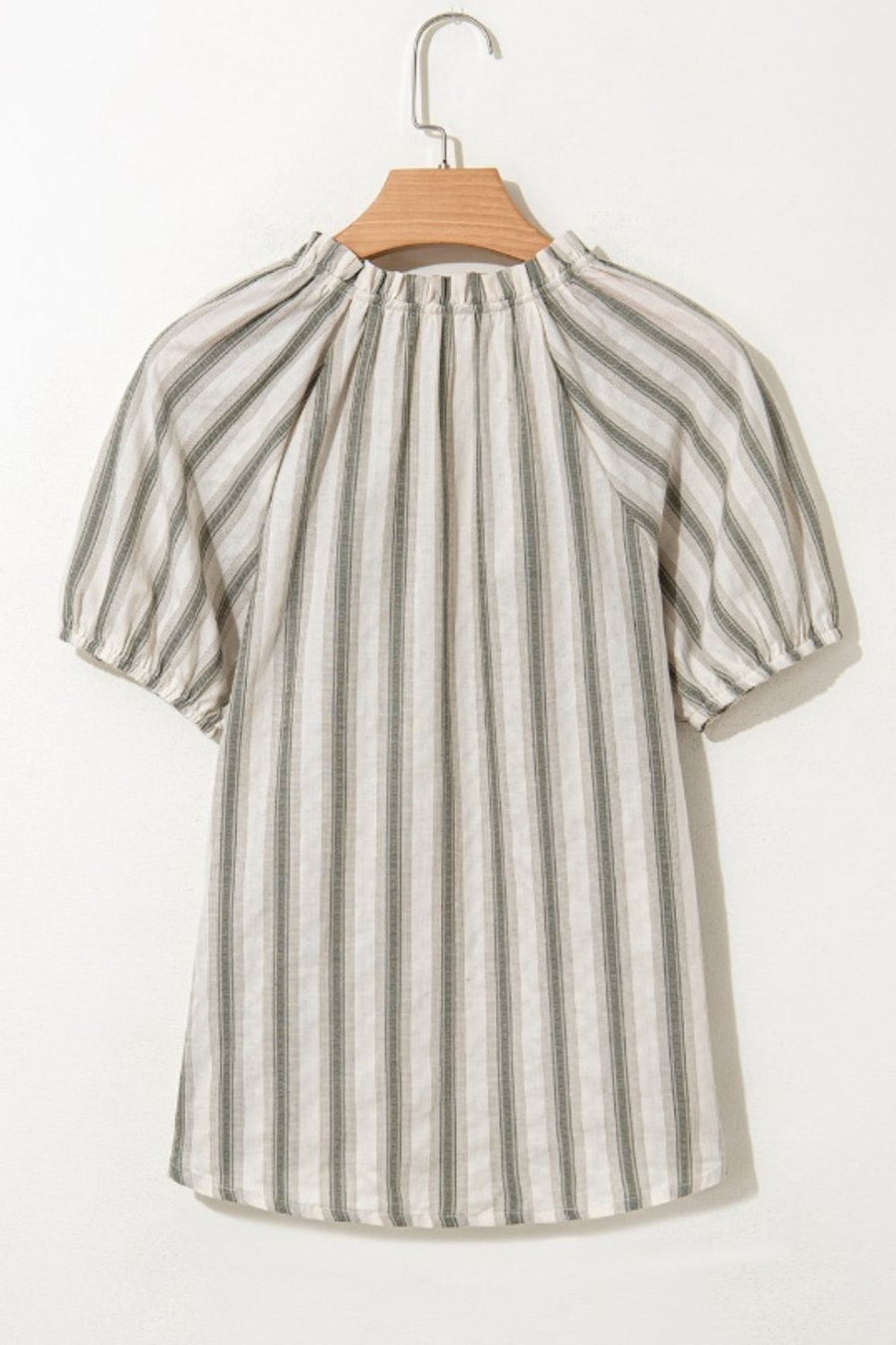 Striped linen blouse with gathered neckline and puff sleeves.