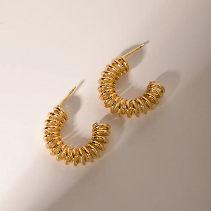 Gold vermeil spiral coil hoop earrings with a coiled design.