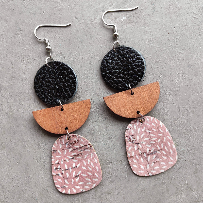 Black, wood, and pink patterned dangle earrings