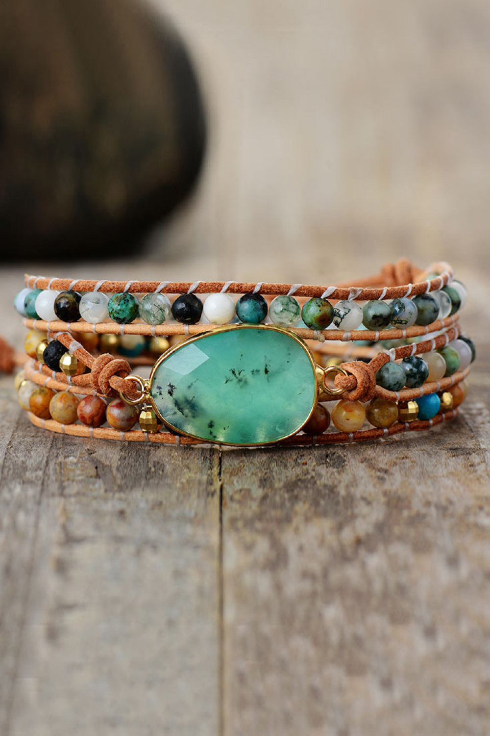 Wrap-around bracelet with light green agate gemstone and mixed beads on leather cords
