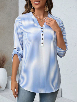 Light blue striped V-neck blouse with roll-up sleeves and button detail