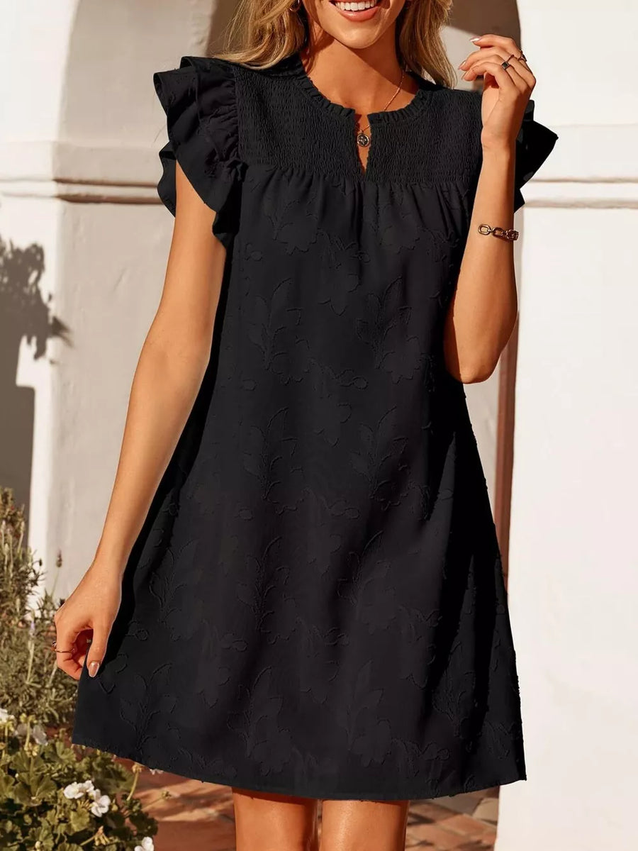 Black floral embossed mini dress with smocked bodice and ruffled sleeves.