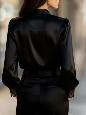 Black satin button-up shirt with balloon sleeves and lace trim cuffs