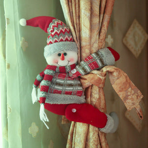 Snowman curtain tieback with red hat and scarf, grey and red plaid sweater, red pants.