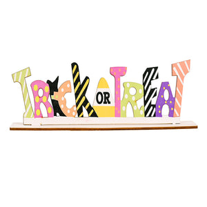 Whimsical Halloween word block trio with assorted patterns and colors spelling "TRICK OR TREAT".