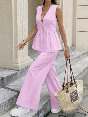 Pink V-neck sleeveless peplum top with button and wide-leg pants set.