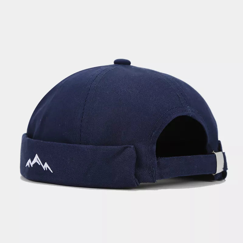 hat in navy blue featuring adjustable strap and fitted fit