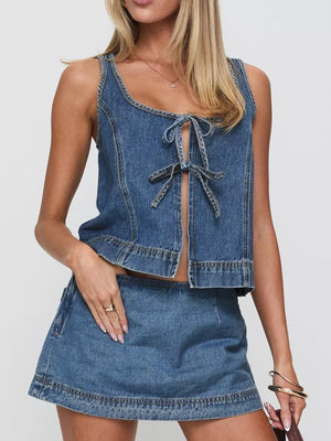 Blue denim tie-front tank top and mini skirt set with a scoop neckline.