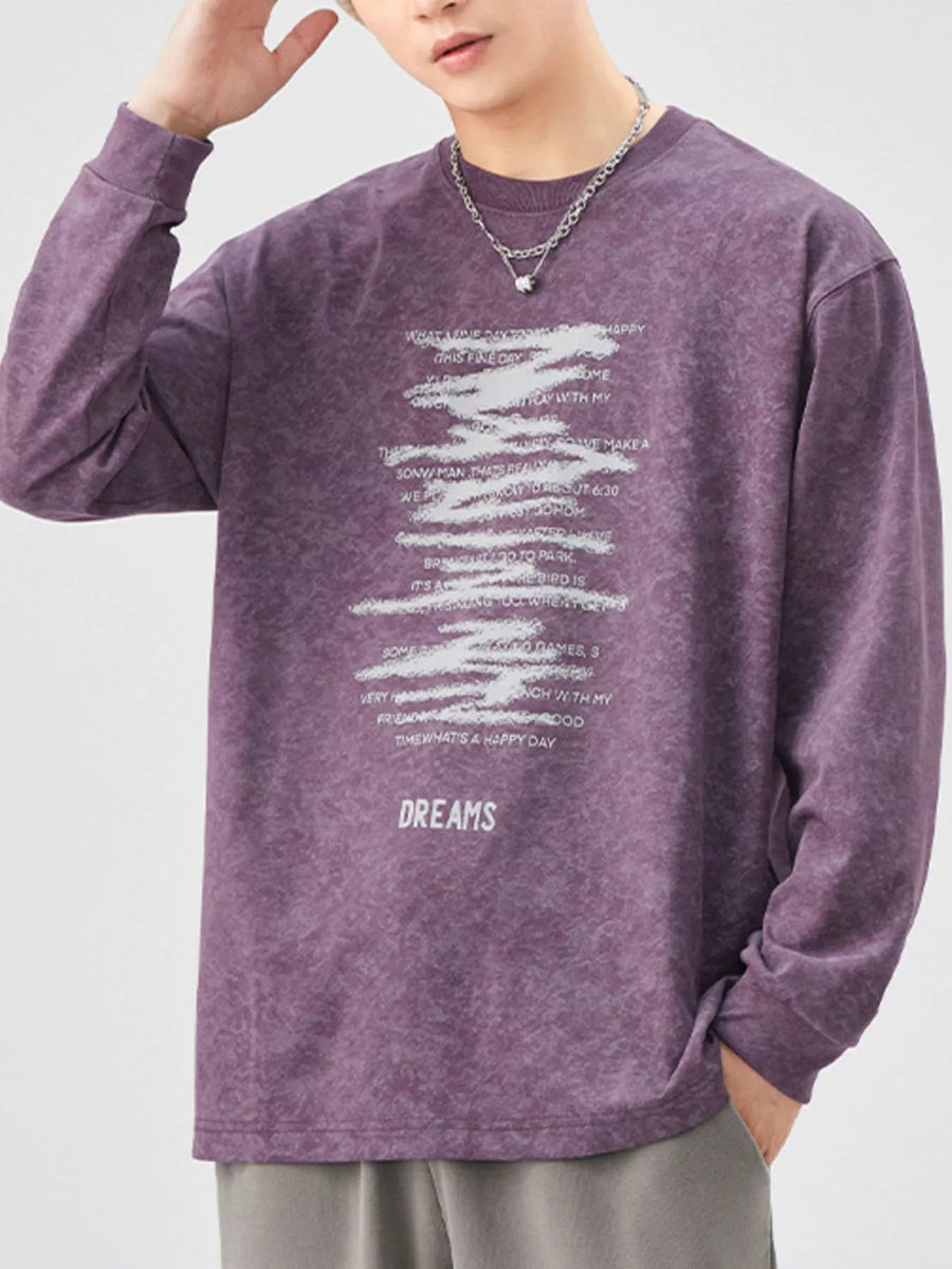 Purple oversized long-sleeve tee with graphic text print and "DREAMS" graphic.