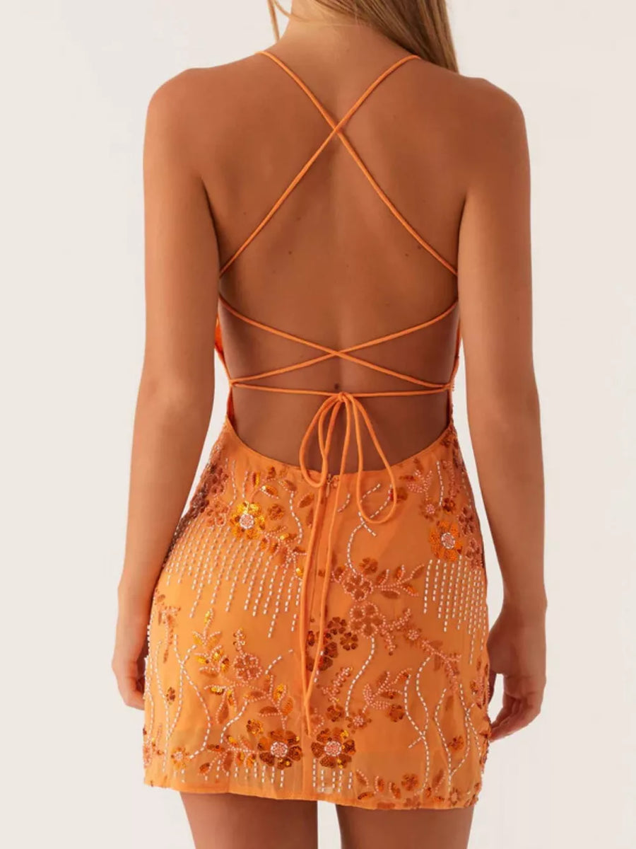 Tangerine mini dress with floral sequin and bead embellishments and a strappy back.