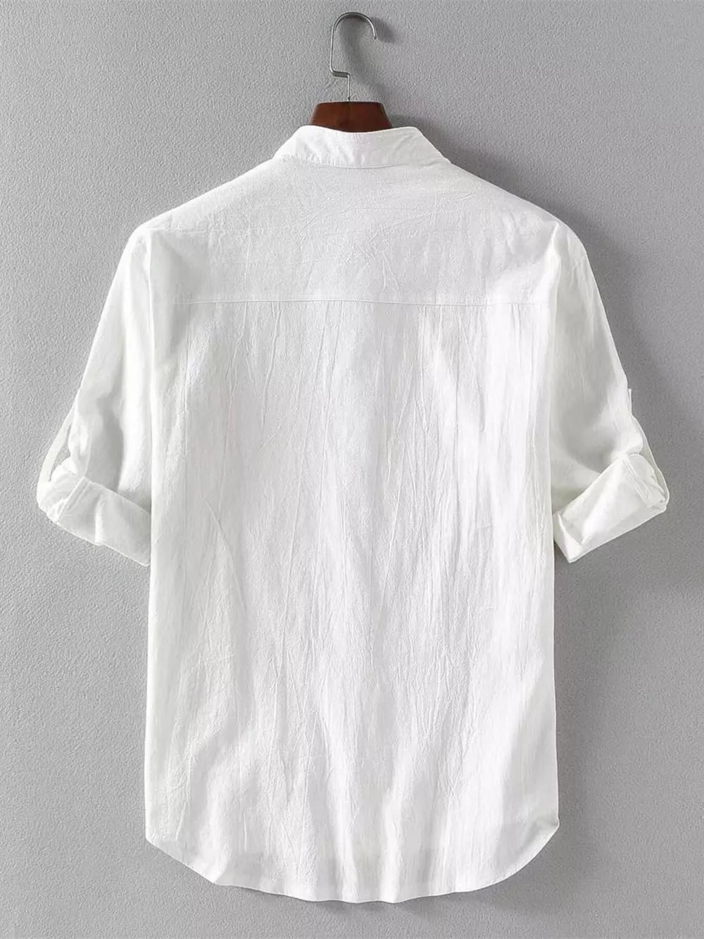 White casual button-up shirt with band collar and rolled sleeves.