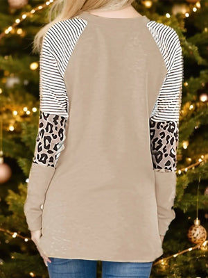 Tan raglan sleeve sweatshirt with black and white stripes and leopard print panels.