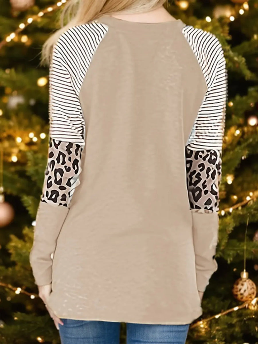 Tan raglan sleeve sweatshirt with black and white stripes and leopard print panels.