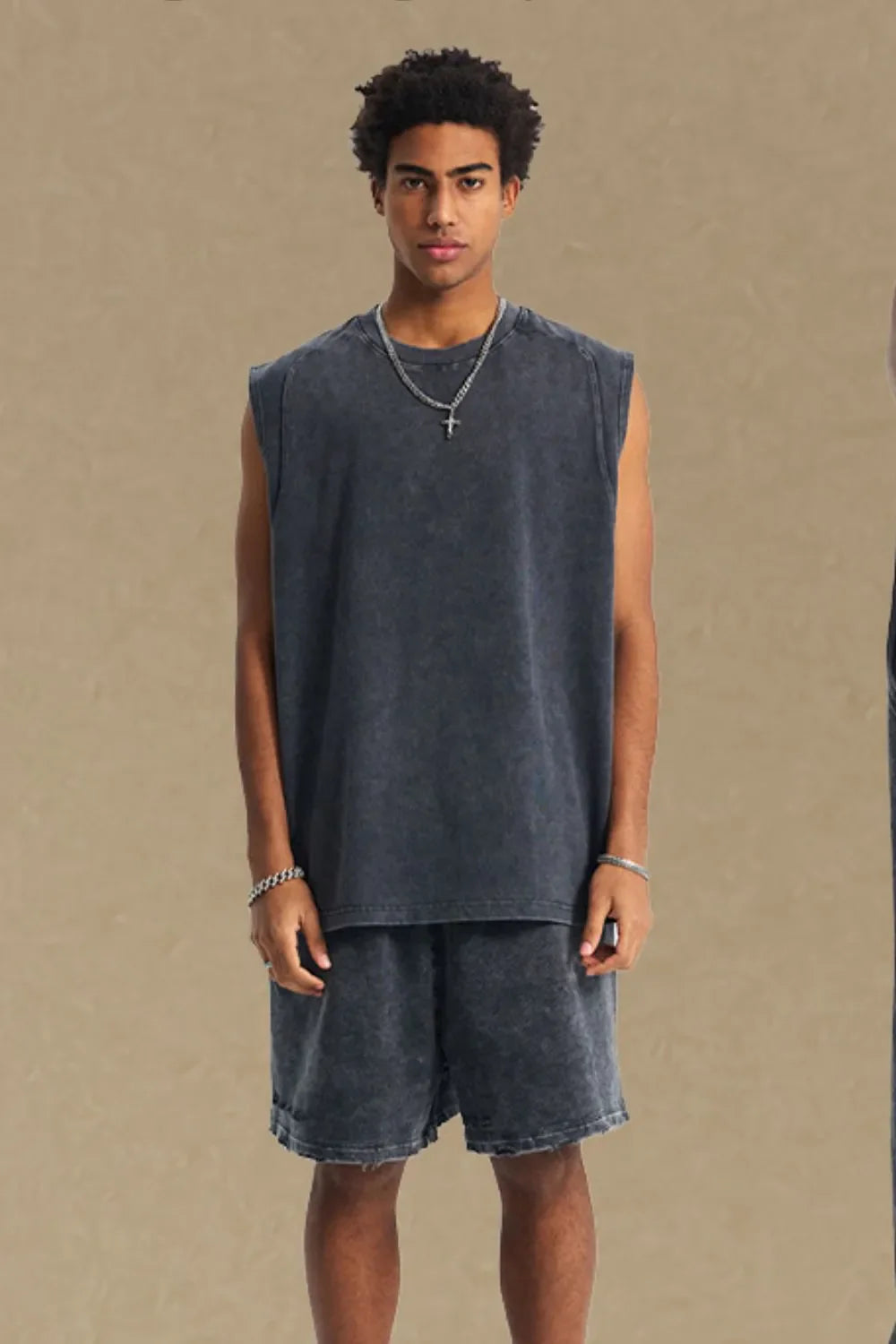 Acid wash dark gray relaxed fit tank top with crew neck and sleeveless cut.