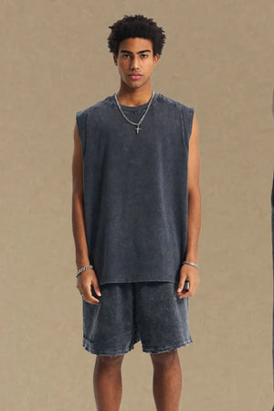 Acid wash dark gray relaxed fit tank top with crew neck and sleeveless cut.