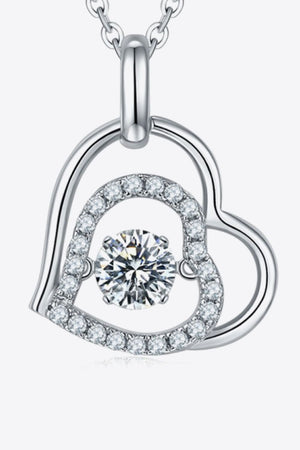 Silver floating heart necklace with pave diamond accents and a central sparkling stone.