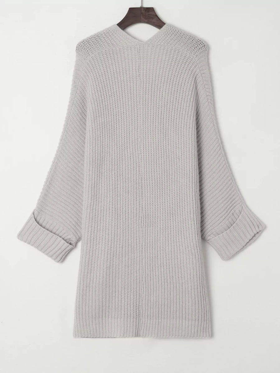 Light gray acrylic knit cardigan with open front, ribbed texture, and cuffed sleeves.