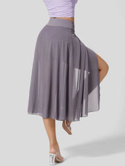 Flowy midi skirt in grey with a thigh-high slit and shorts liner, featuring a drawstring waist.