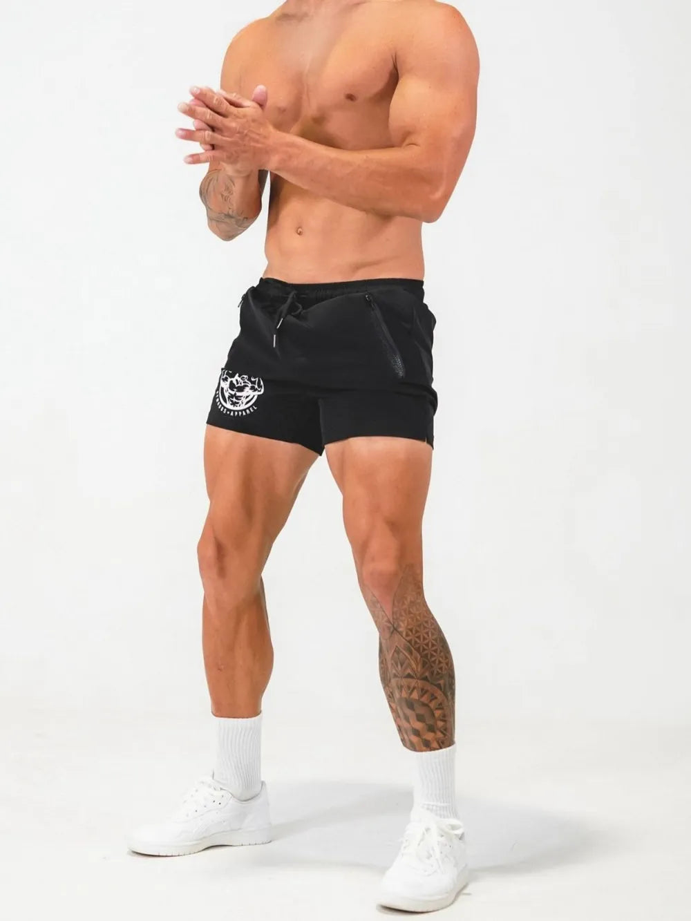 Black athletic shorts with drawstring and zippered pockets, featuring a white logo graphic.