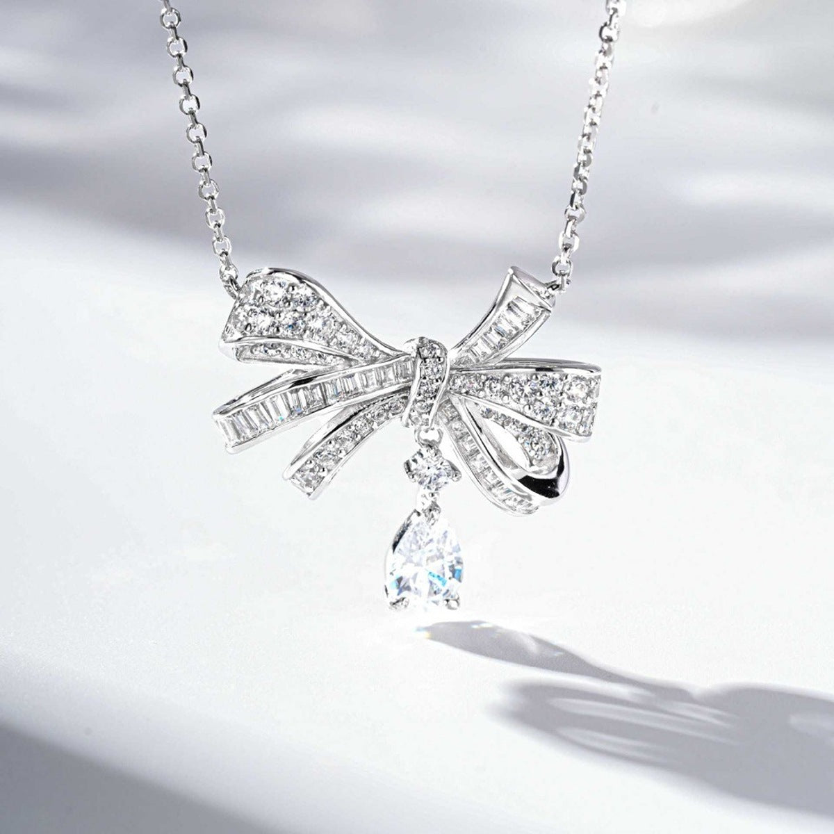 necklace in clear with bow design and princess
