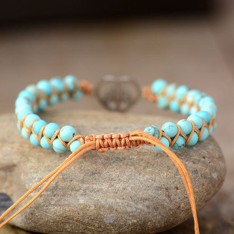 Light blue turquoise bead bracelet with macrame detail and heart charm
