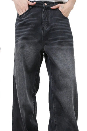 Feline Whisker Denim Jeans in dark gray, featuring a relaxed fit and subtle whiskering details.