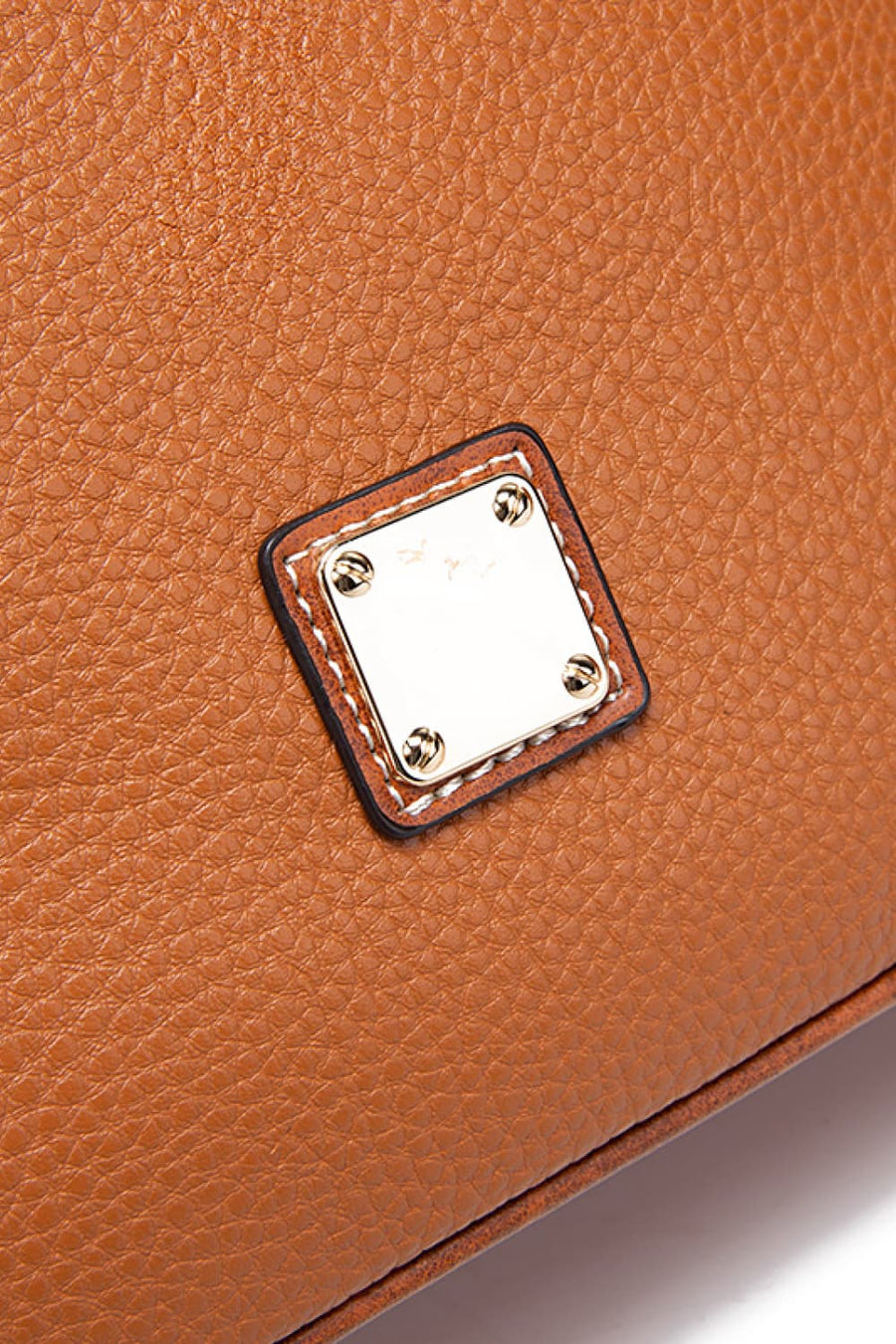 Golden Hour Leather Crossbody in Coffee Brown with gold-tone hardware detail.