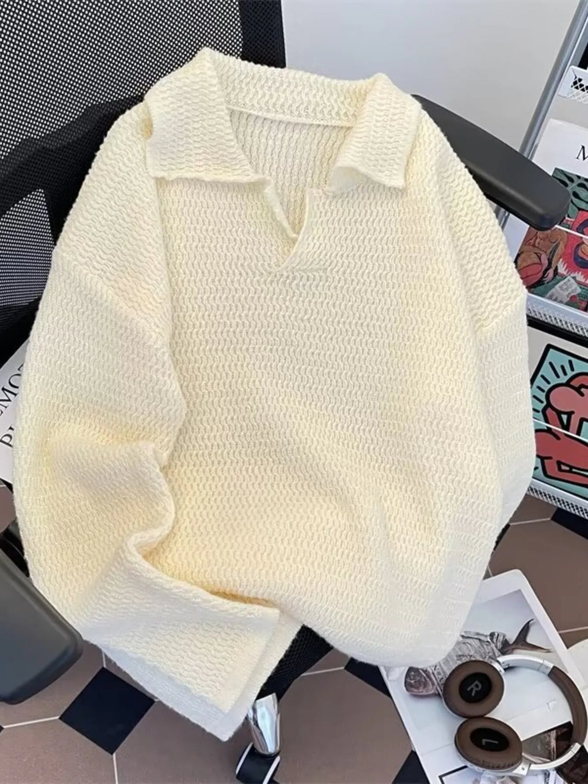 Textured knit polo collar sweater in apricot with a relaxed fit and v-neck.