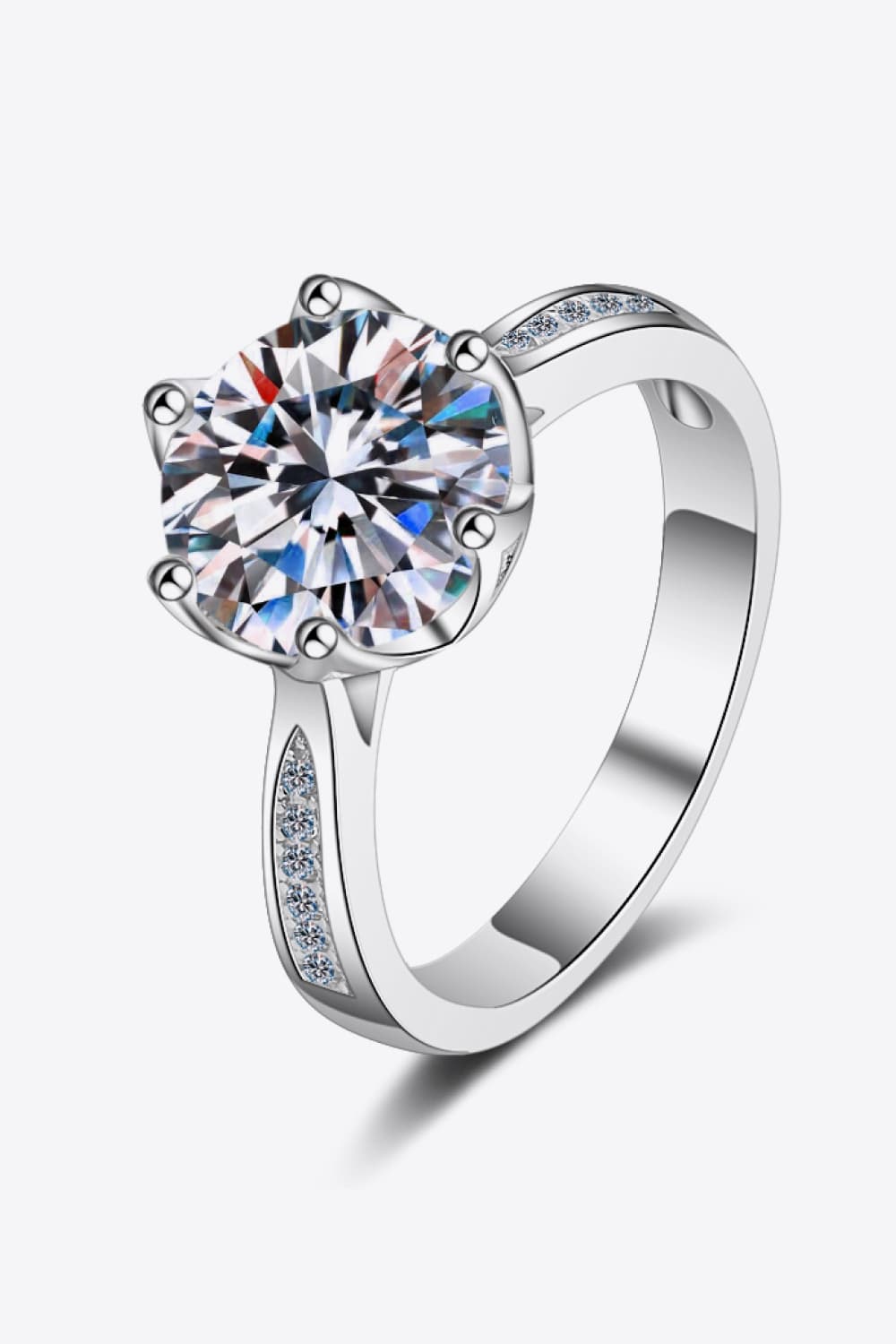 Silver ring with a large round moissanite and pavé band