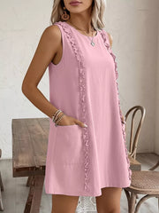 Blush pink sleeveless frill-detail pocketed dress with a round neckline.