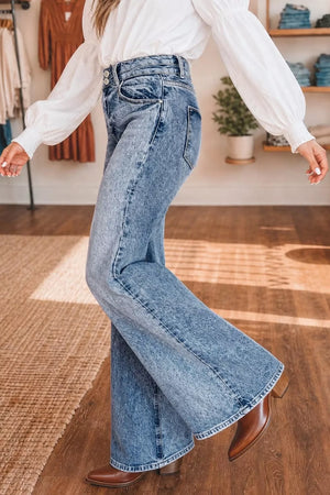 Wide leg jeans in acid wash denim with a high rise and button fly.