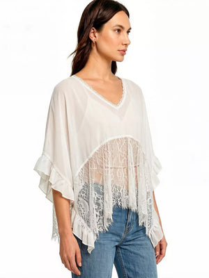 White sheer flowing cover-up tunic with lace trim and ruffled sleeves.