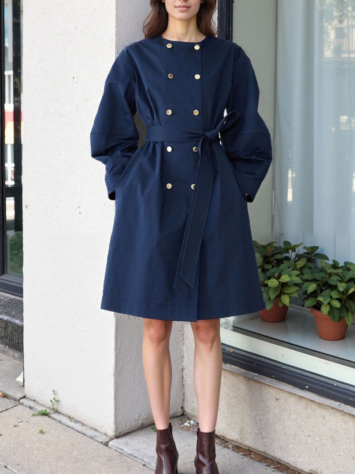 trench coat in navy blue featuring tied and A-line fit