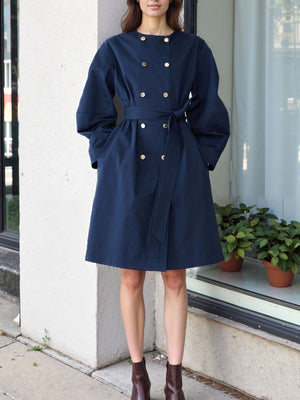 trench coat in navy blue featuring tied and A-line fit
